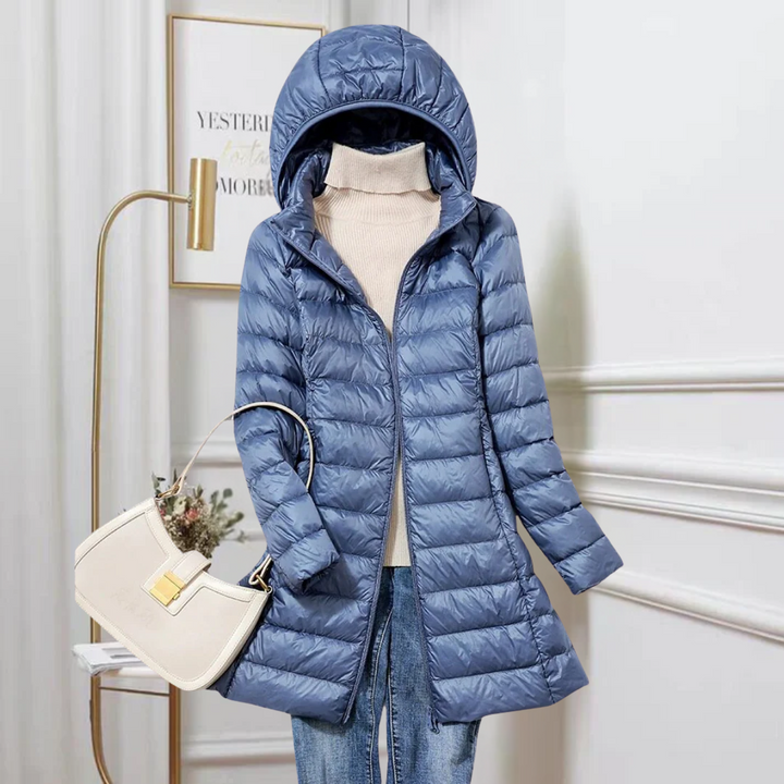 Women's ultra-lightweight puffer jacket, packable for travel. Warm, versatile autumn/winter outerwear.