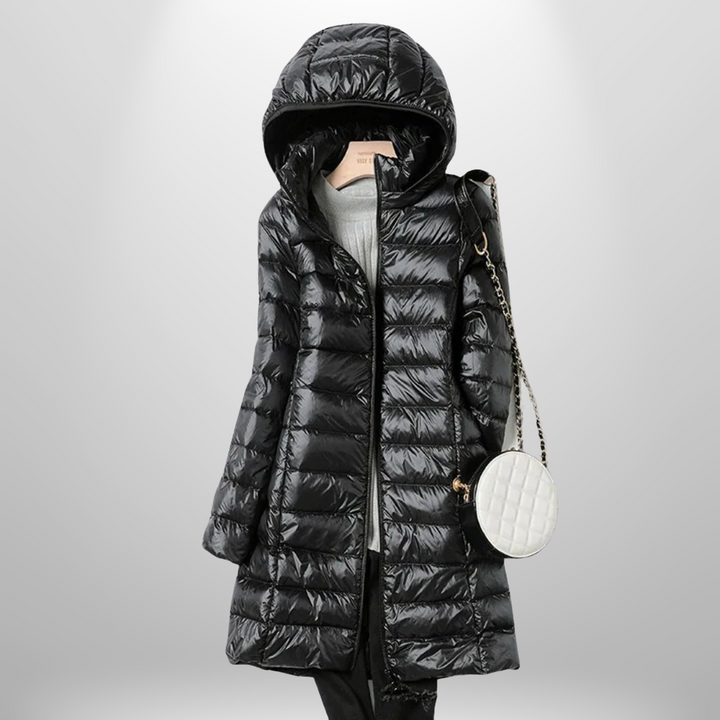 Women's travel puffer jacket, ultra-lightweight & packable. Provides warm, essential outerwear for cold trips.