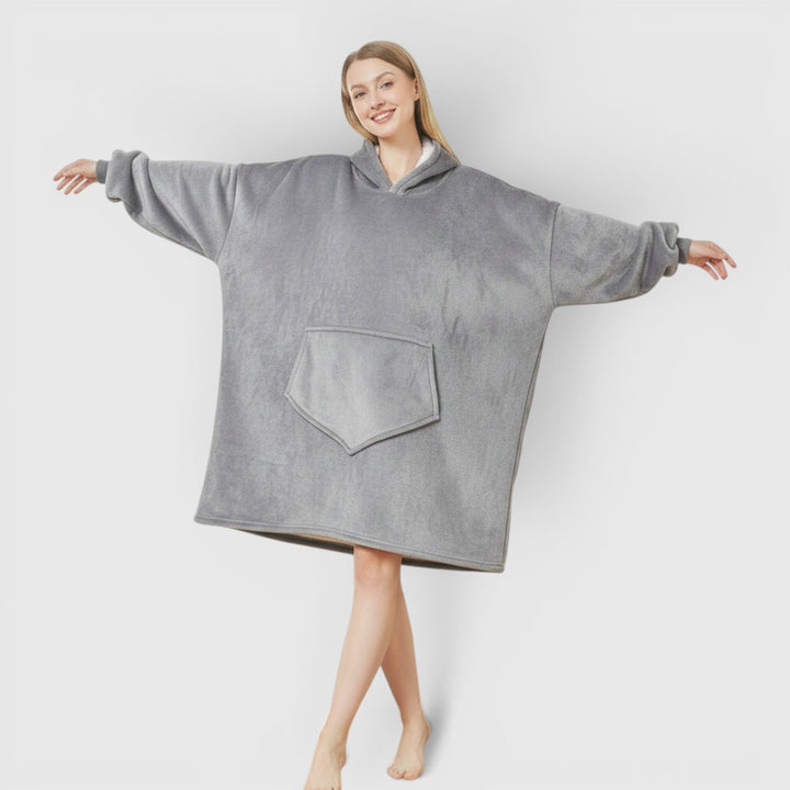 Hooded women's ultra soft blanket, offering cozy wearable comfort. Perfect for relaxing at home.