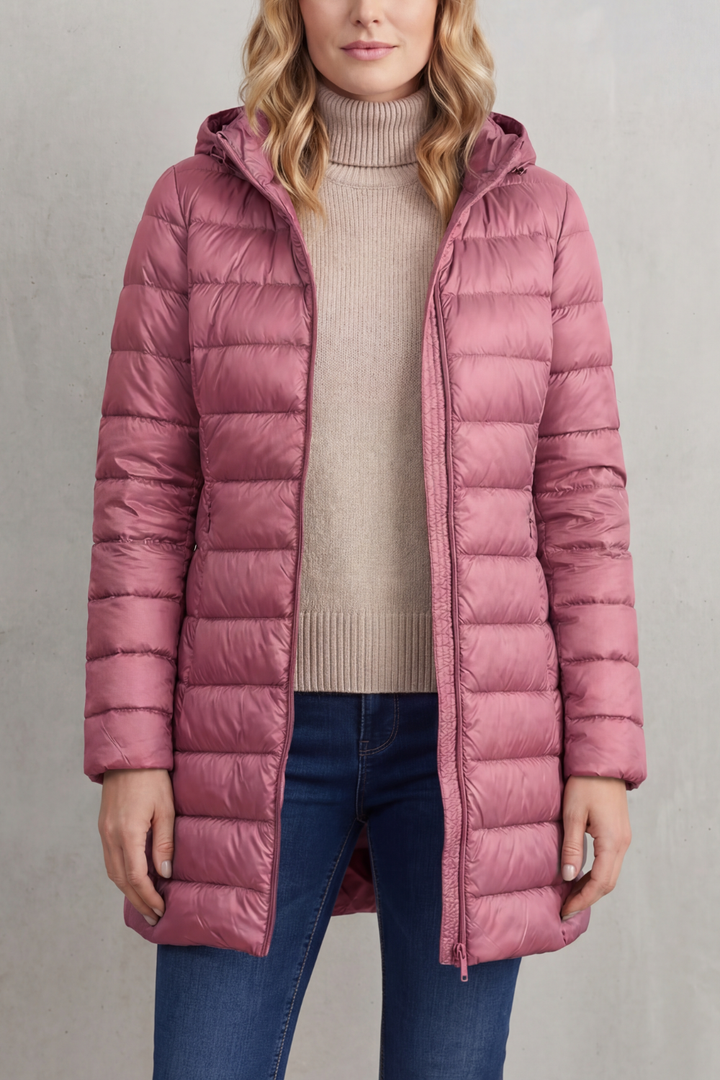 Women's warm & packable hooded puffer jacket. Ideal lightweight outerwear for winter travel.