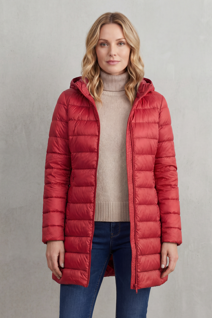 Women's ultra-warm hooded puffer jacket. Lightweight, cozy, and perfect for stylish winter fashion.