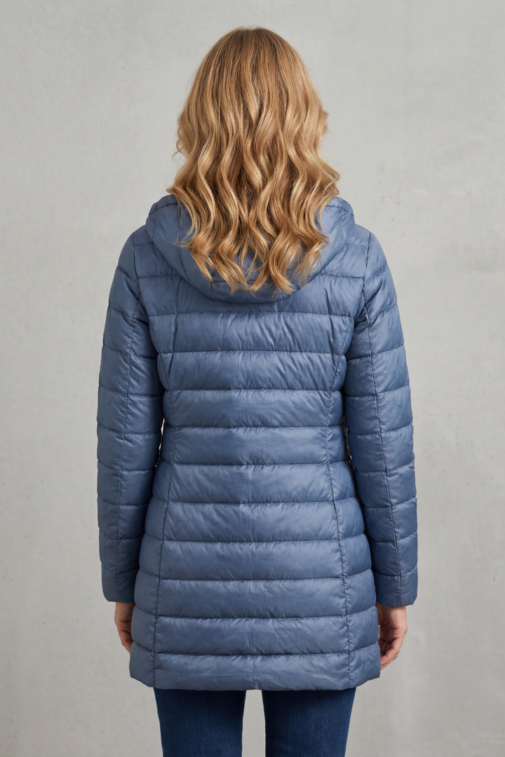 Cozy women's hooded puffer jacket, ultra-warm & packable. Versatile outerwear for winter & fall style.