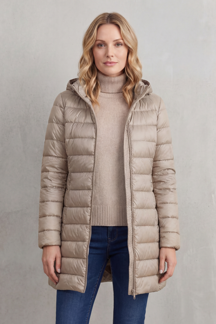 Packable women's hooded puffer jacket. Ultra-warm & cozy for winter adventures & everyday wear.