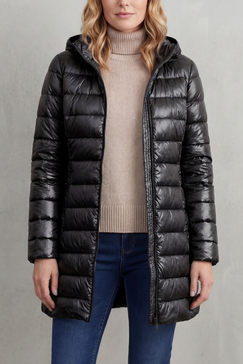 Lightweight women's winter puffer jacket. Hooded for extra warmth, essential packable travel gear.