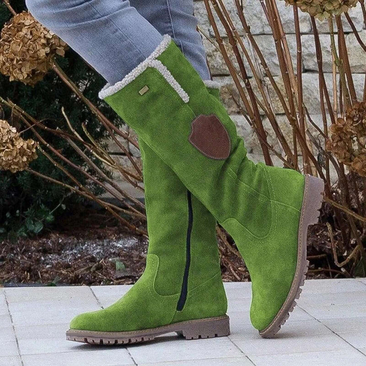 Durable women's outdoor winter boots with thick insulation & rugged slip-resistant tread for snow & ice.
