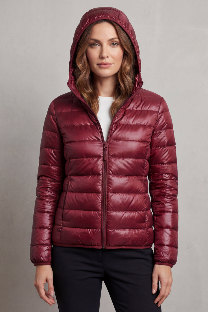 Women's performance ultralight puffer jacket with hood, packable for on-the-go lifestyles.