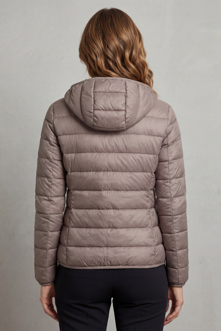 Cozy women's ultralight puffer coat, hooded and packable, great for layering & travel.