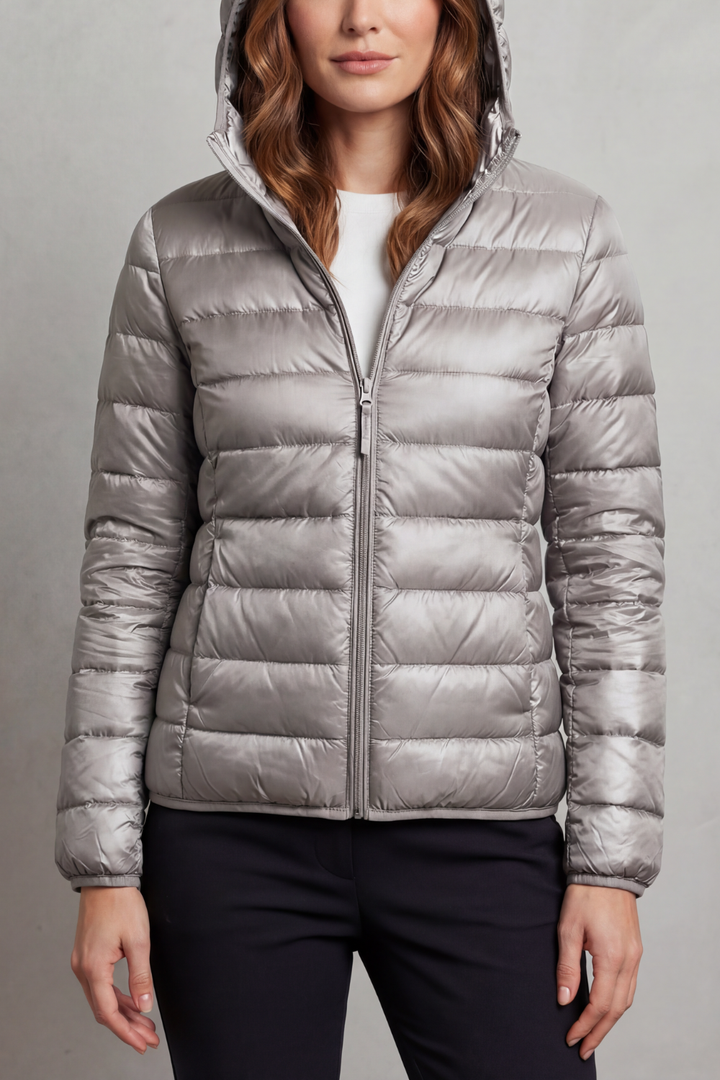 Packable women's hooded puffer jacket, ultralight outerwear for spring, fall, and everyday comfort.