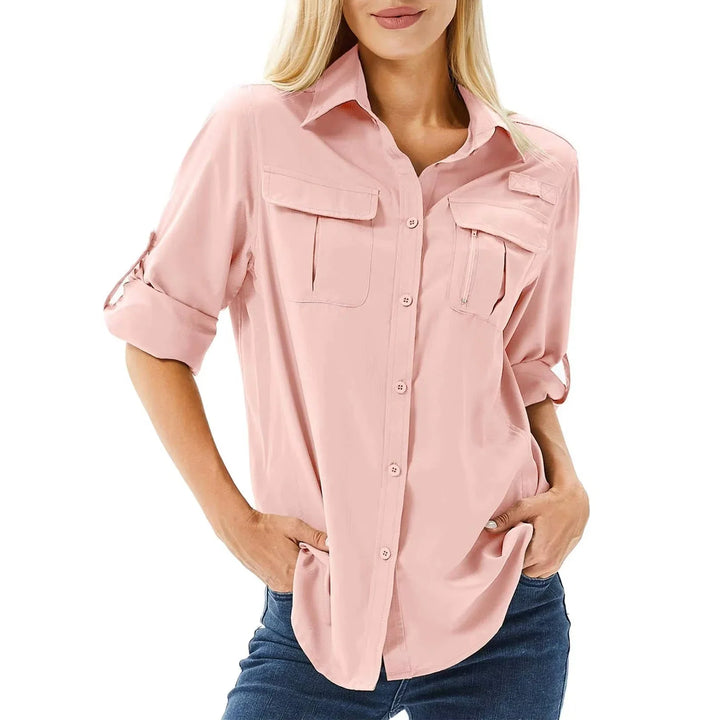 Women's UPF 50 long roll-up sleeve hiking shirt with zip pockets, ideal for outdoor adventures.