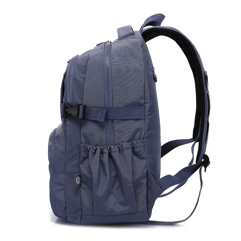 Urban women's nylon commuter backpack, water-resistant for laptops & essentials.