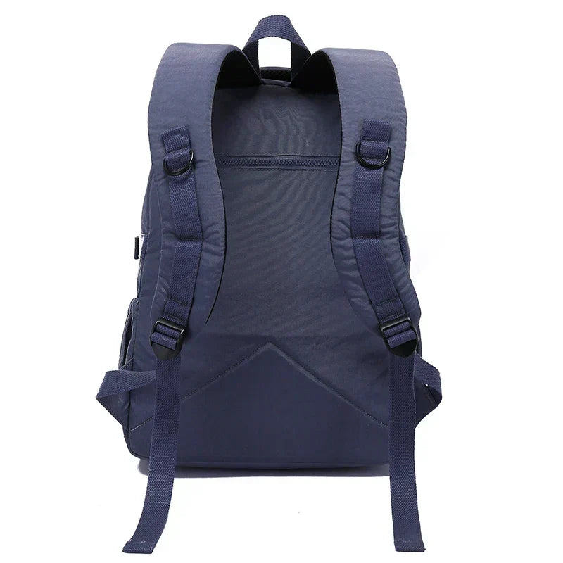 Women's stylish backpack, water-resistant nylon, durable for travel & daily use.