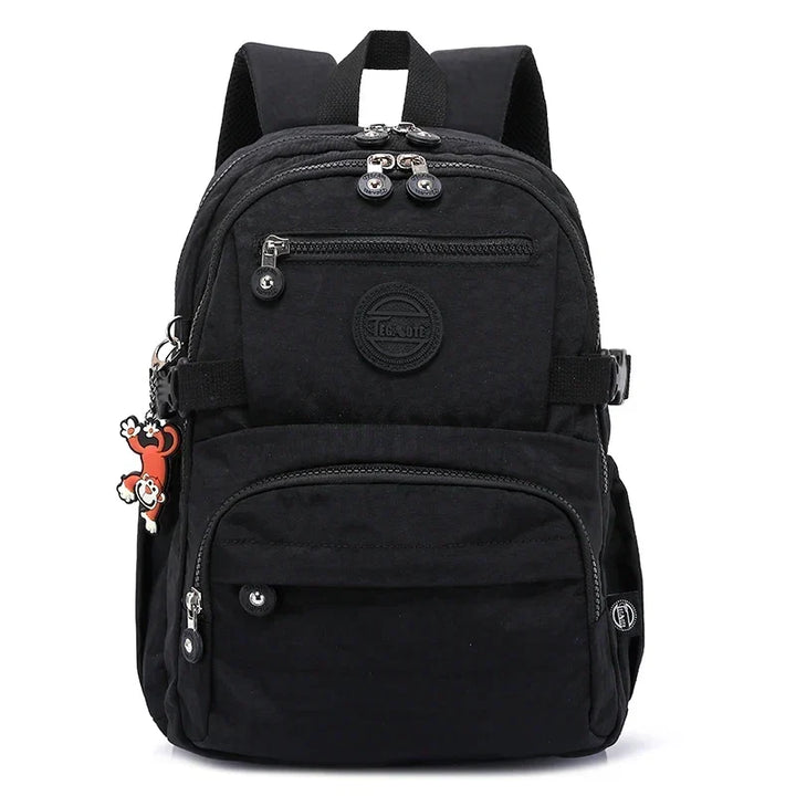 Stylish women's nylon backpack, perfect for work, school & everyday travel.