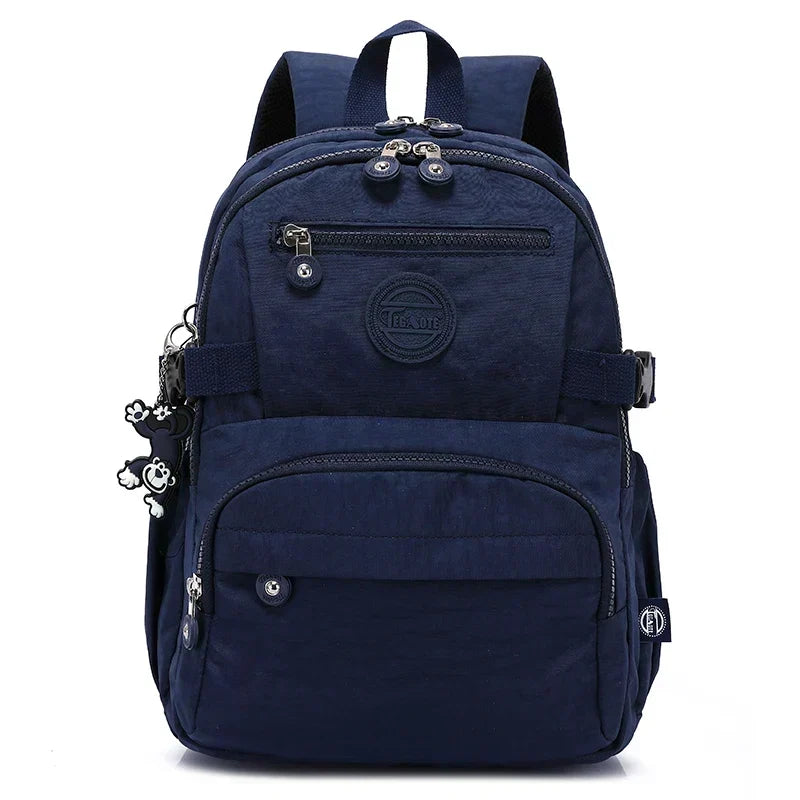 Durable water-resistant nylon backpack for women, ideal for urban commuting.