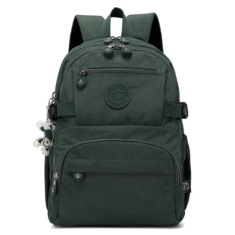 Women's travel backpack with organizer, black nylon, water-resistant & stylish.