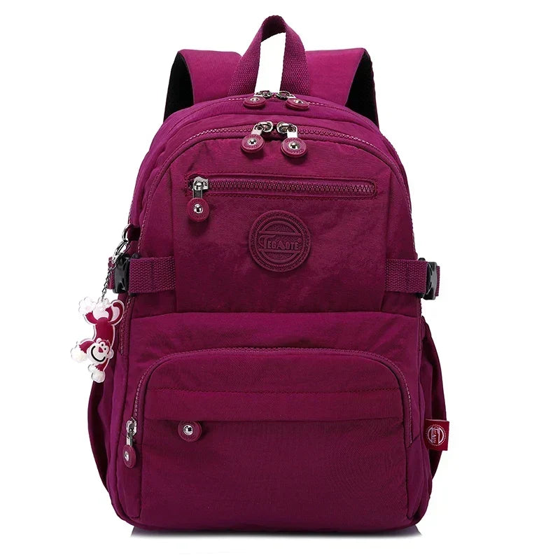 Urban commuter women's backpack, water-resistant nylon, stylish & spacious.