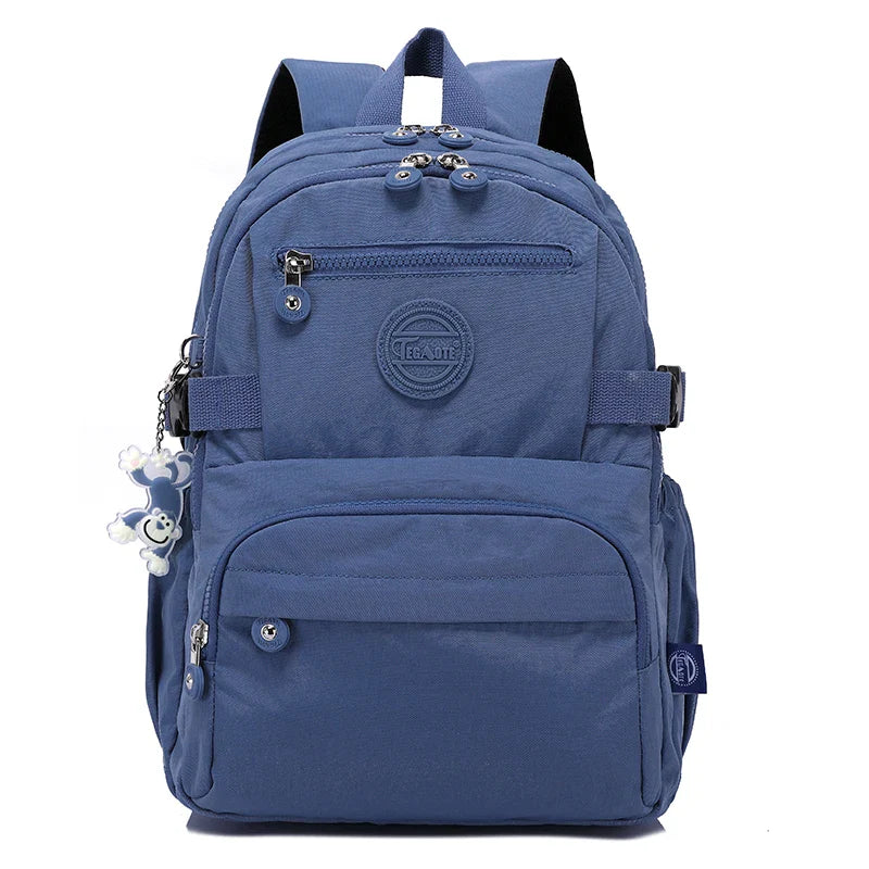 Women's durable work backpack, black nylon, water-resistant, with organizer pockets.