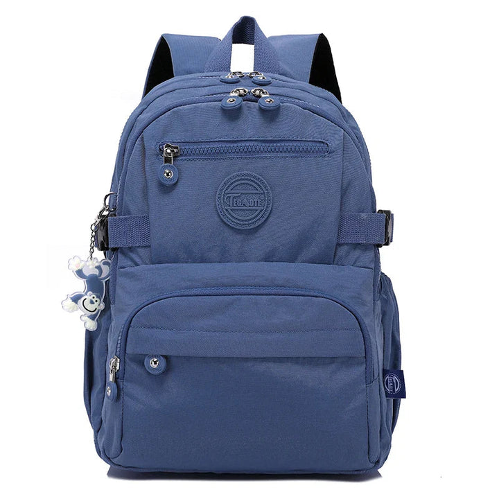 Women's durable work backpack, black nylon, water-resistant, with organizer pockets.