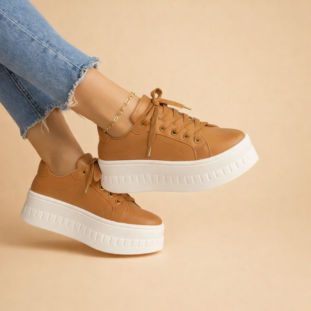 Women's urban platform sneakers in white leather, offering elevated style and comfort.