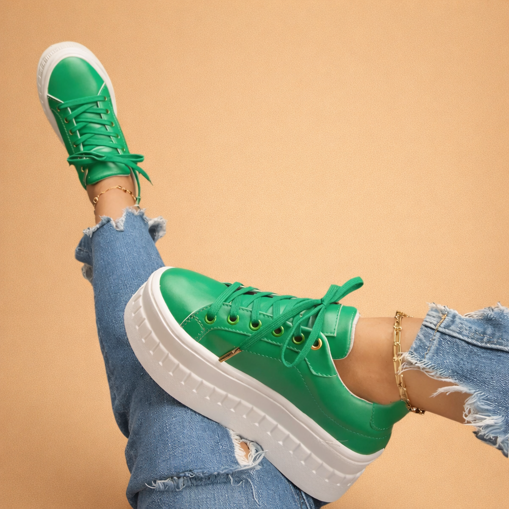 Pair of women's platform sneakers in a neutral tone, ideal for everyday urban wear.