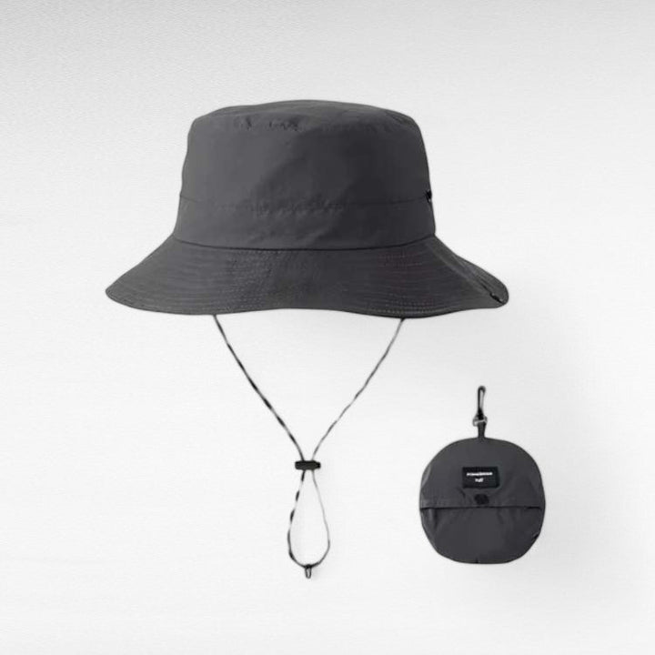 Elegant women's foldable beach hat with wide brim, offering UV protection for summer.