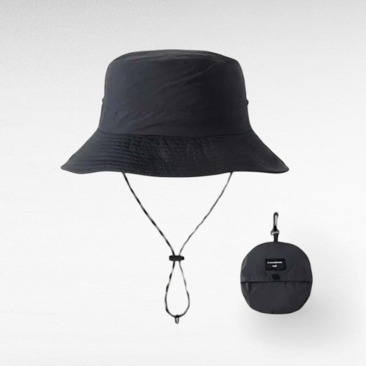 Foldable women's travel sun hat with a wide brim, ensuring UV protection for summer adventures.
