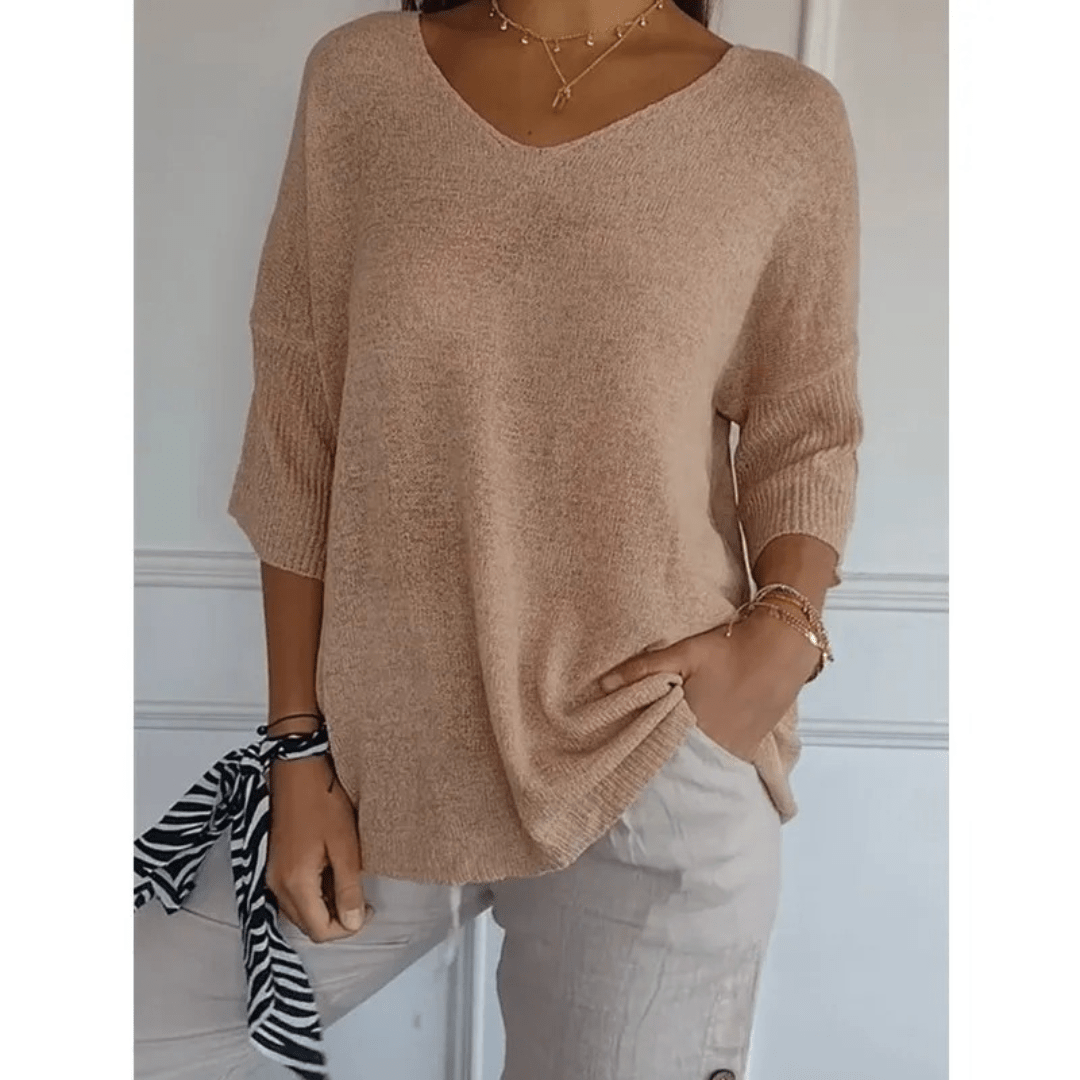 Classic women's 3/4 sleeve V-neck top. A versatile and comfortable blouse for all seasons.