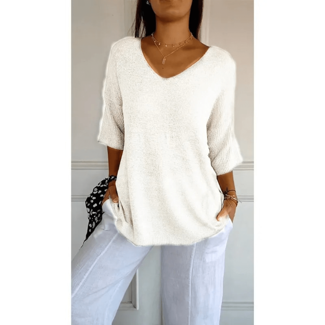 Women's relaxed fit V-neck top with 3/4 sleeves. A comfortable blouse for summer style.