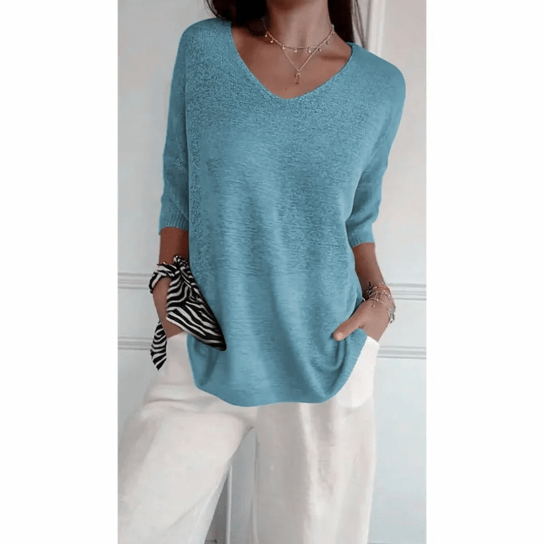 Relaxed fit women's V-neck top with 3/4 sleeves. Ideal for spring & summer fashion.