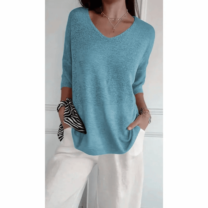 Relaxed fit women's V-neck top with 3/4 sleeves. Ideal for spring & summer fashion.