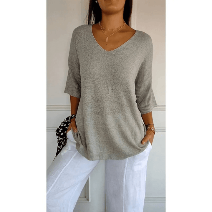 Stylish women's V-neck blouse, featuring comfortable 3/4 sleeves for effortless style.