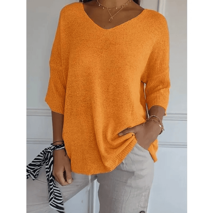 Chic women's top with V-neckline & 3/4 sleeves. A comfortable choice for any casual occasion.