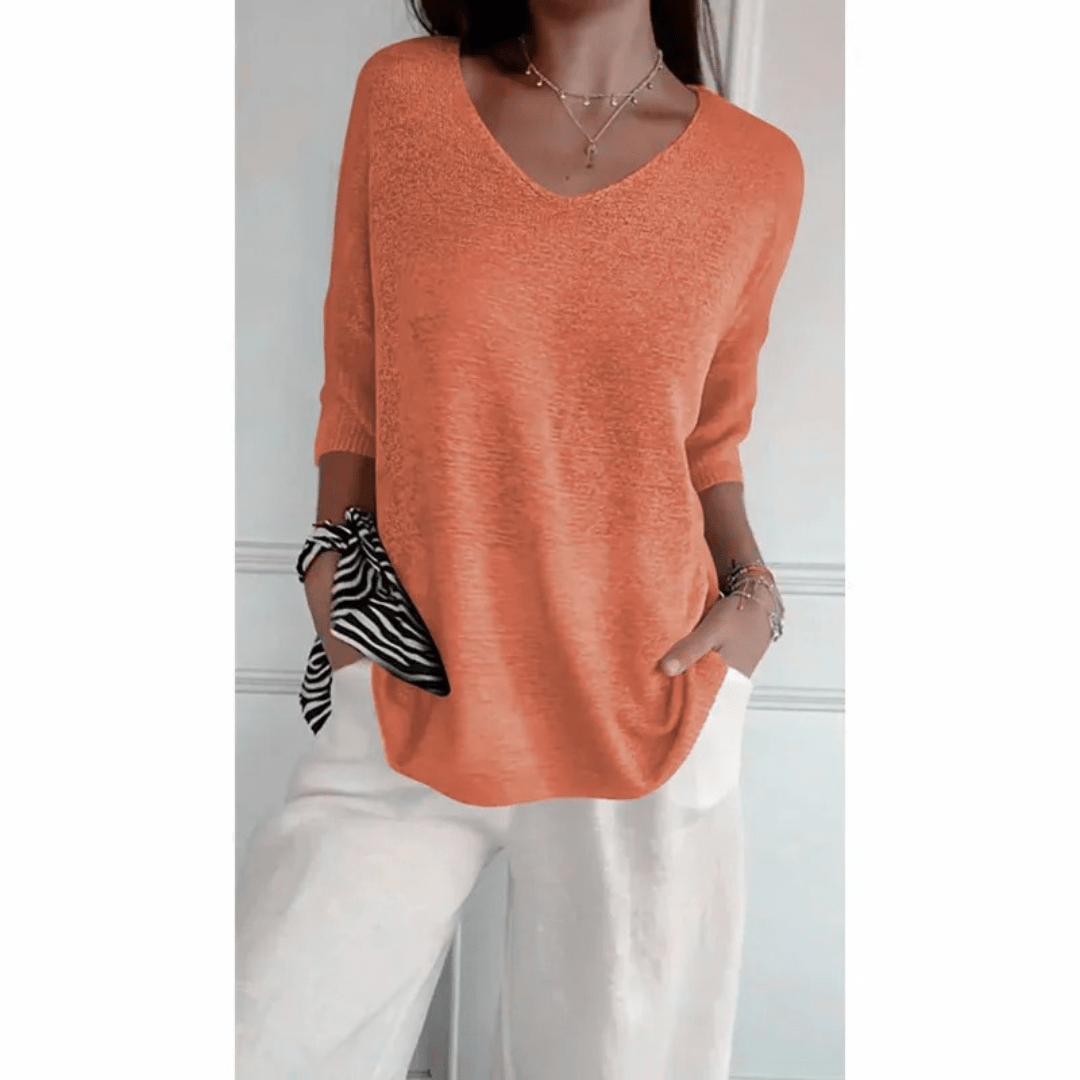 Women's comfortable V-neck top with 3/4 sleeves, essential for spring/summer everyday style.