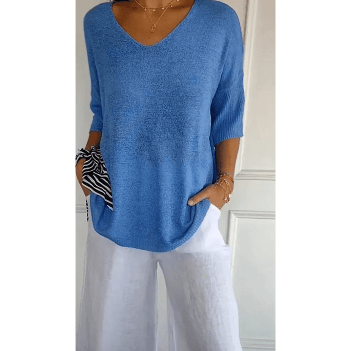 Effortless women's V-neck 3/4 sleeve top. Perfect casual blouse for versatile styling.