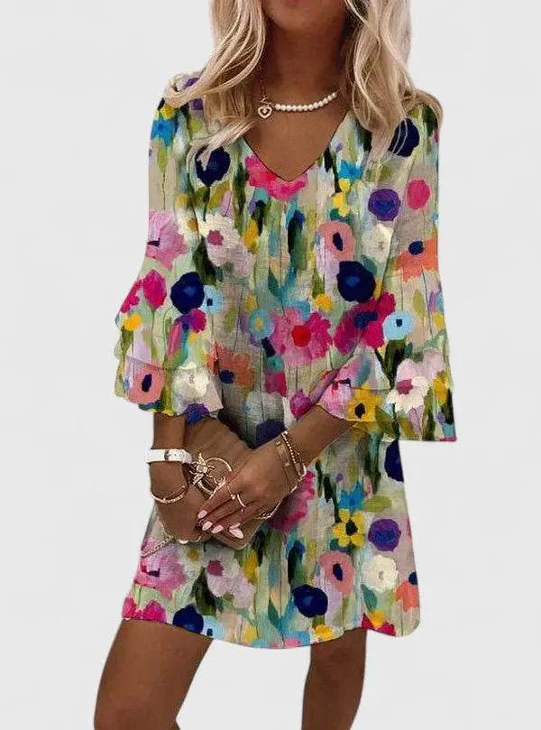 Women's V-neck abstract floral mini dress with long sleeves. Perfect for spring & summer casual or party wear.