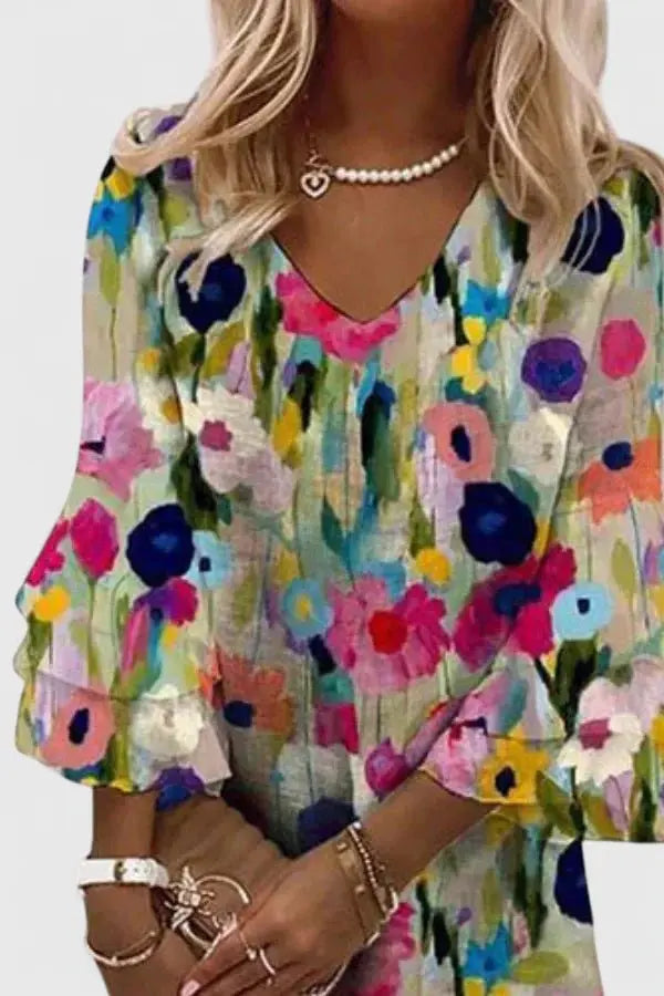 Feminine abstract floral print mini dress for women, featuring a flattering V-neck & elegant long sleeves.