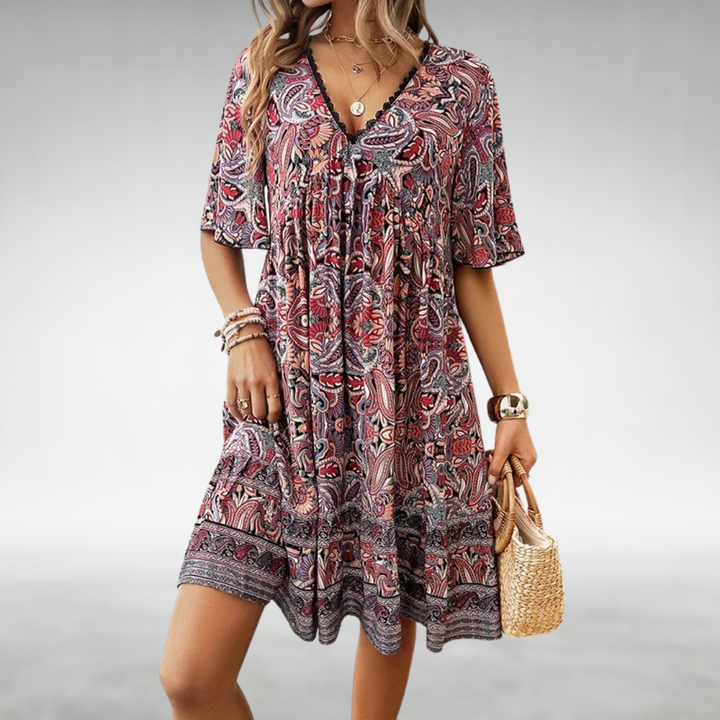 Vibrant women's summer bohemian dress with a relaxed fit & flowing fabric, great for festivals or vacation.