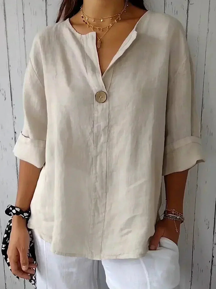 Women's V-neck button-down blouse with roll sleeves, relaxed fit, perfect for casual or office wear.