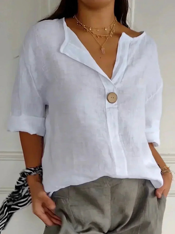 Chic women's V-neck button-down blouse with roll sleeves, versatile for spring, summer & fall fashion.
