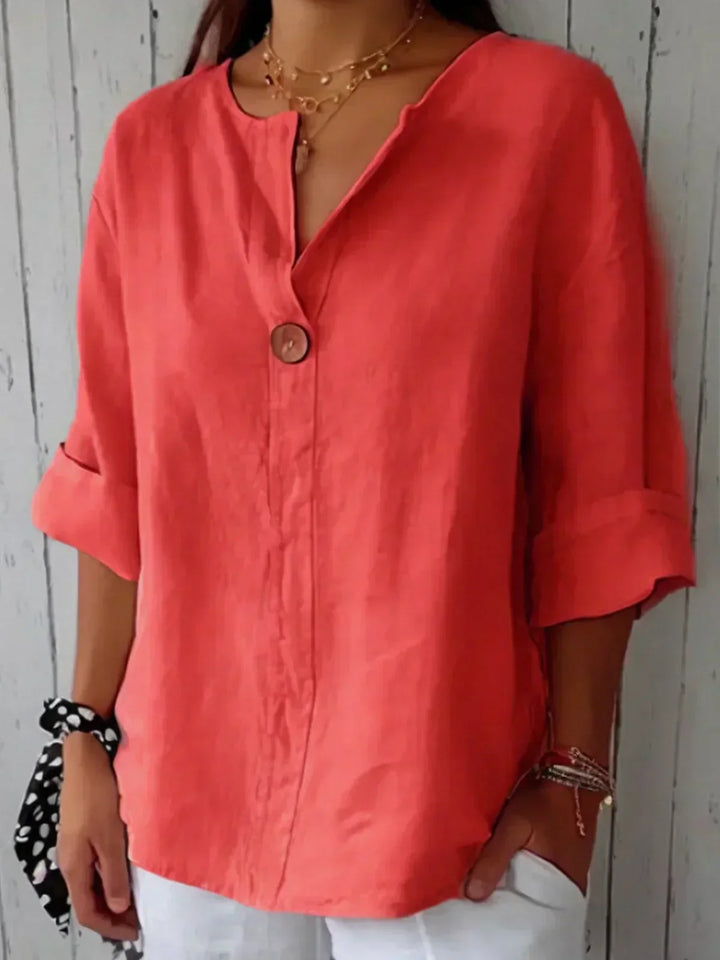 Classic women's button-down V-neck blouse with stylish roll sleeves, great for versatile styling.