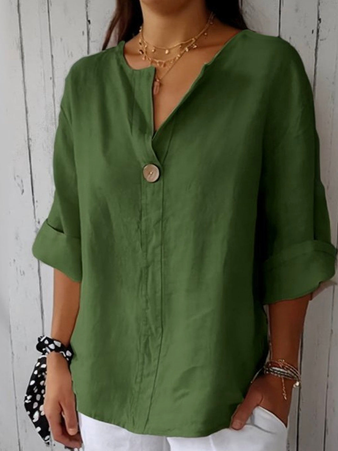 Stylish women's V-neck roll sleeve blouse, button-down front, relaxed fit for chic casual or office looks.