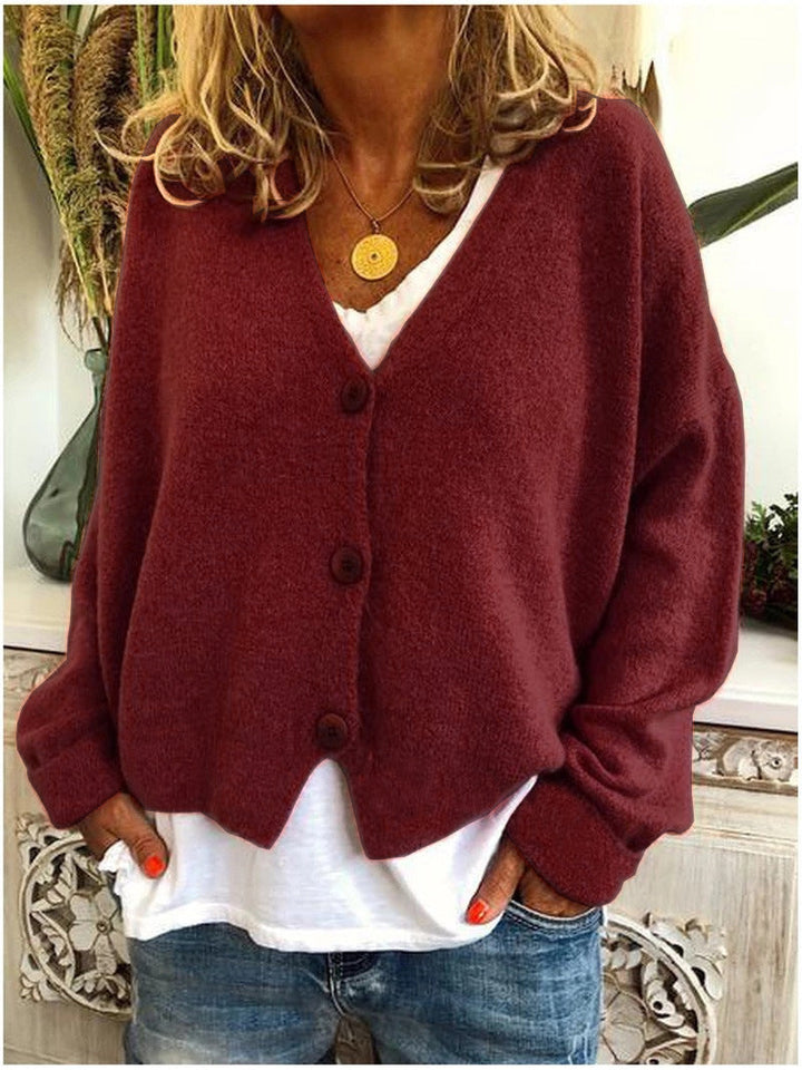 Fashionable women's cropped V-neck cardigan with buttons, an ideal versatile top.