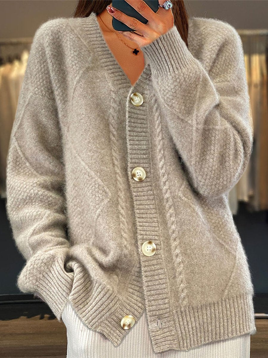 Soft cable knit V-neck cardigan for women. Long sleeve, relaxed fit, ideal for cozy fall and winter fashion.