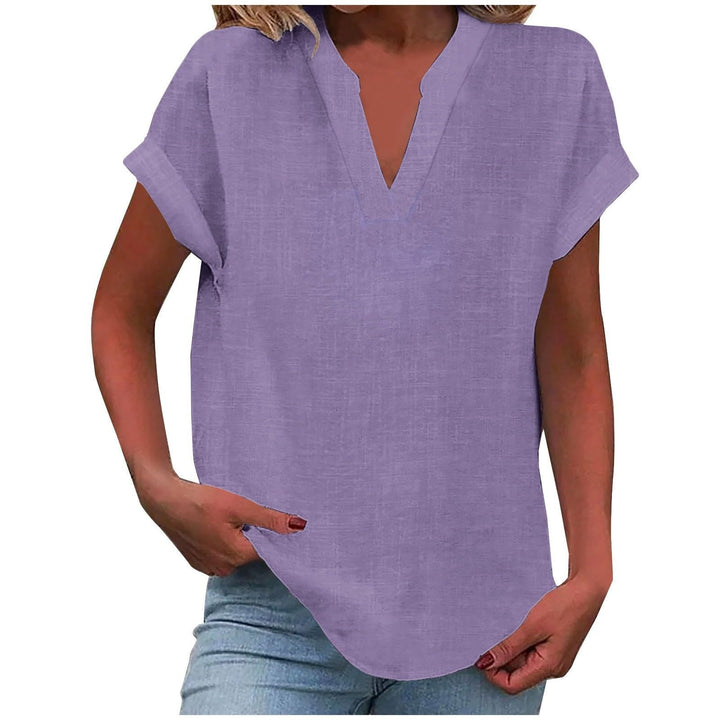 Women's V-neck cap sleeve shirt with textured fabric & stylish curved hem, perfect for casual wear.
