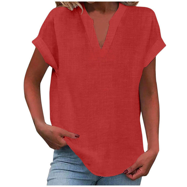 Relaxed fit women's top: textured V-neck, cap sleeves, & a modern curved hem for daily style.
