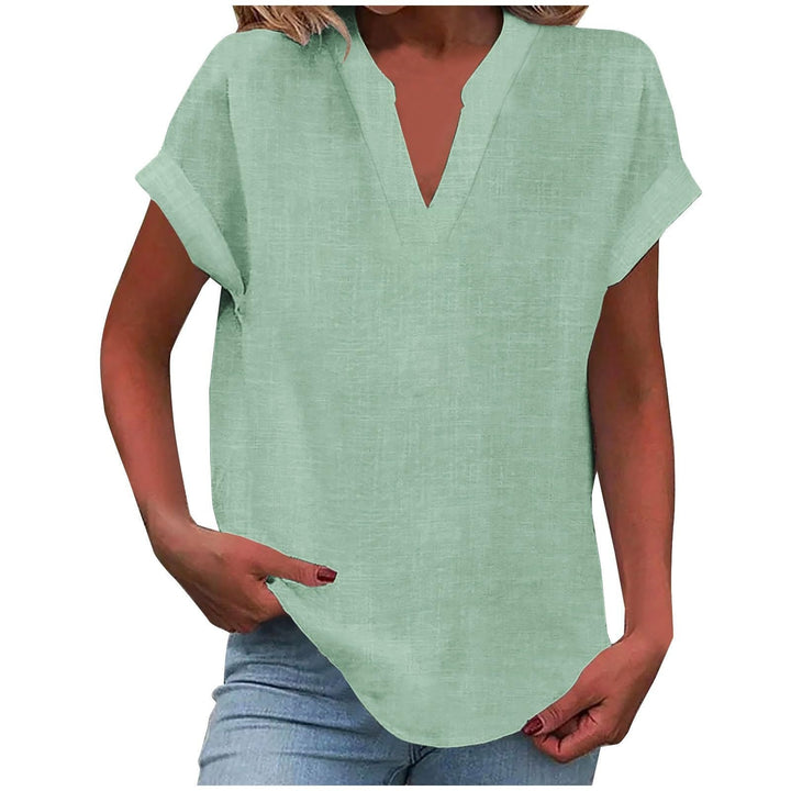 Versatile women's textured V-neck top with cap sleeves & curved hem, great for everyday casual wear.