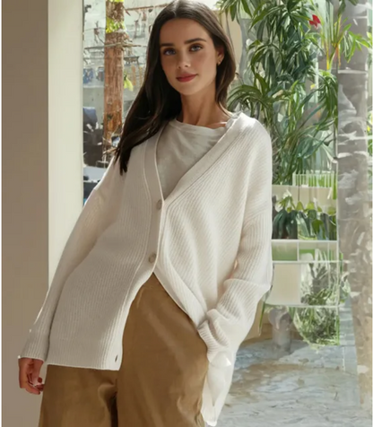 Chic women's V-neck cardigan, soft knitwear for elegant and comfortable layering.
