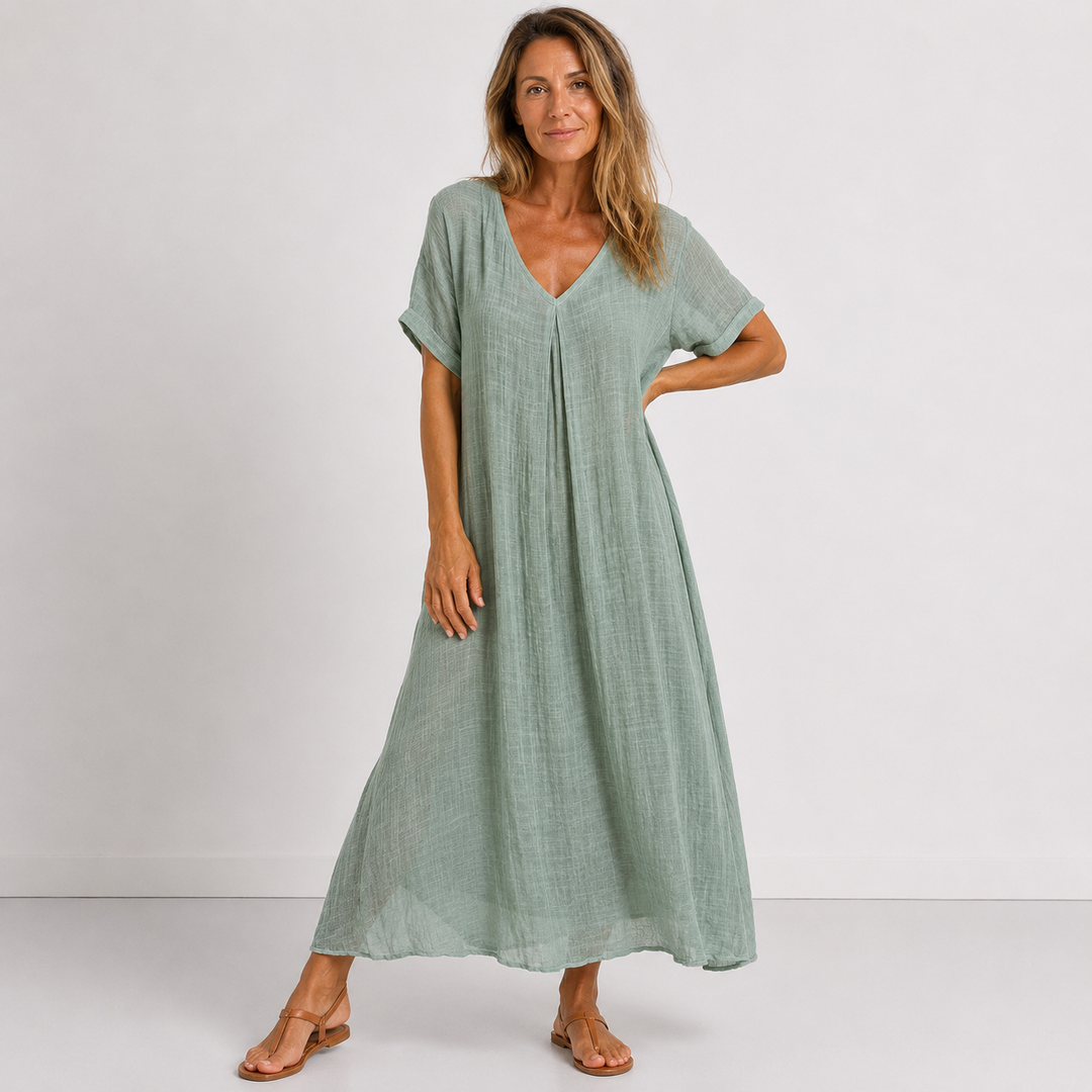 Women's V-neck flowy maxi dress with rolled sleeves. Ideal casual summer wear for relaxed comfort & style.