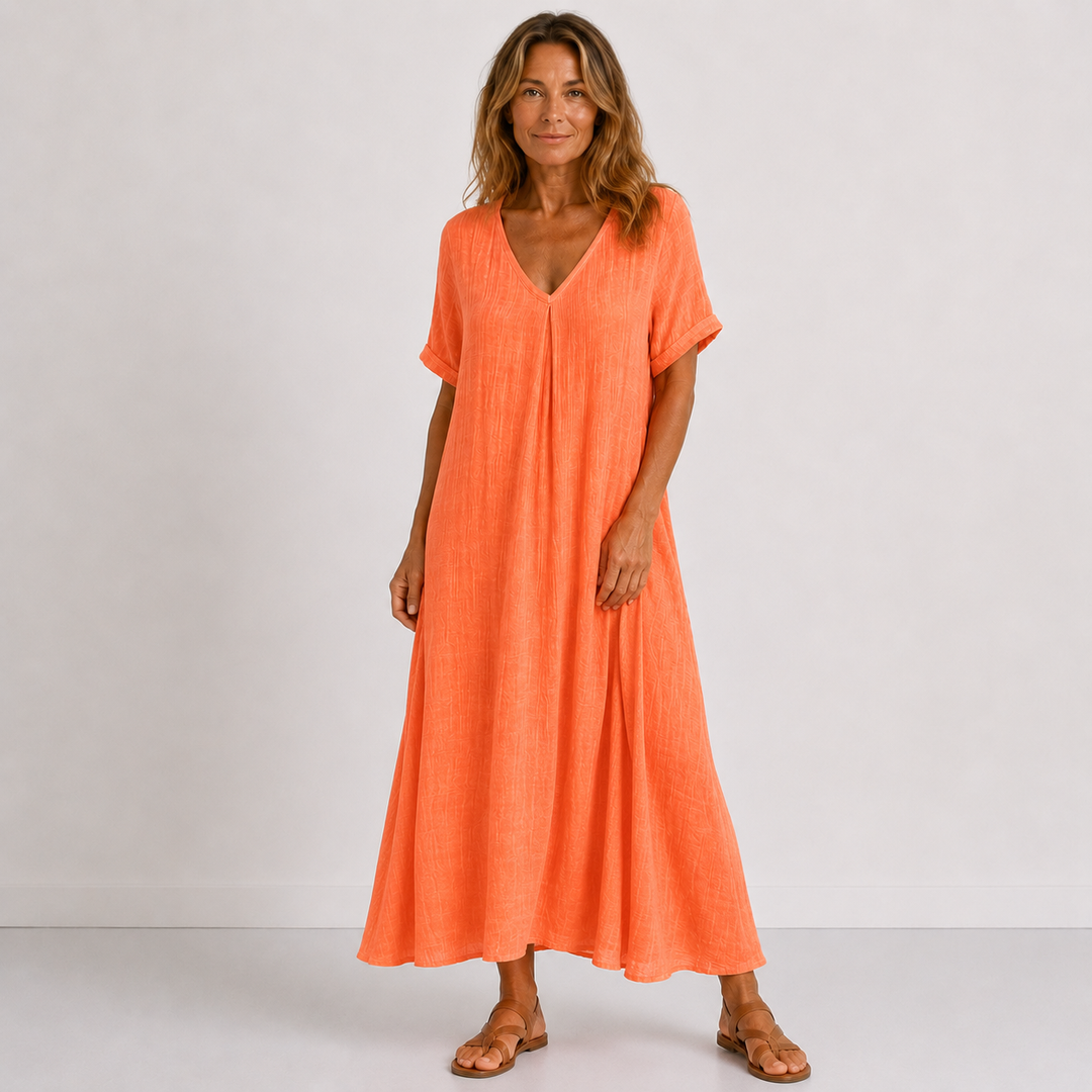 Comfortable women's flowy V-neck maxi dress with rolled sleeves. Relaxed fit for effortless spring/summer fashion.