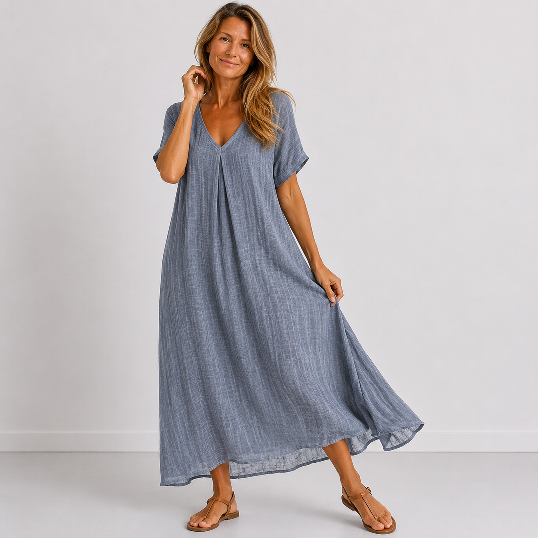 Chic women's V-neck maxi dress with rolled sleeves. A must-have flowy design for stylish spring & summer fashion.