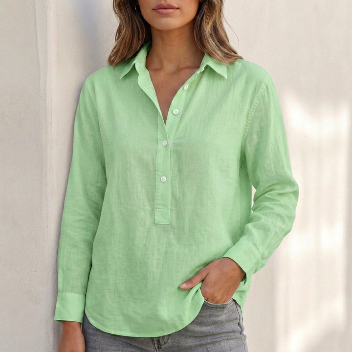 Stylish V-neck blouse with a relaxed fit, showcasing summer fashion trends.